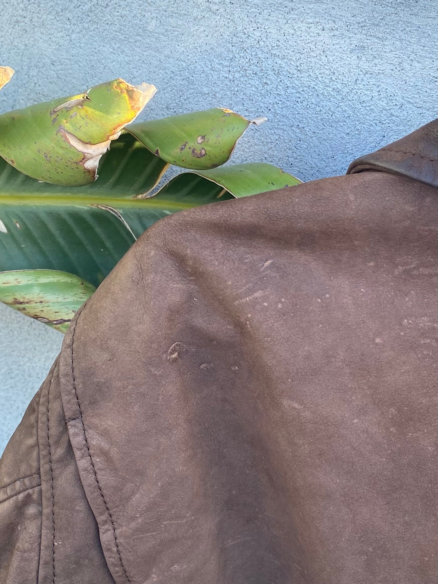 Brown leather bomber jacket
