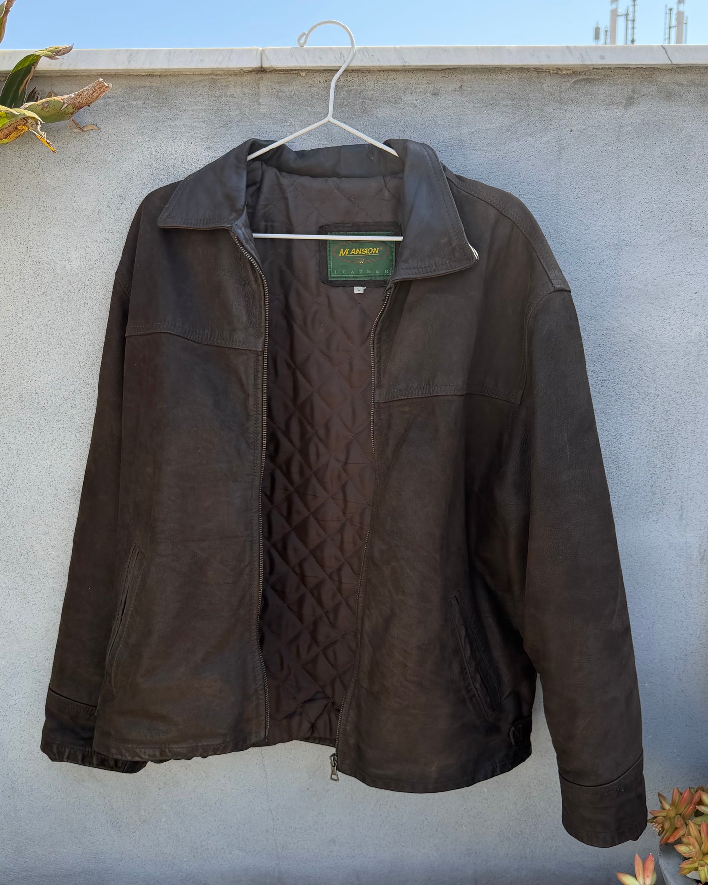 Brown distressed leather bomber jacket