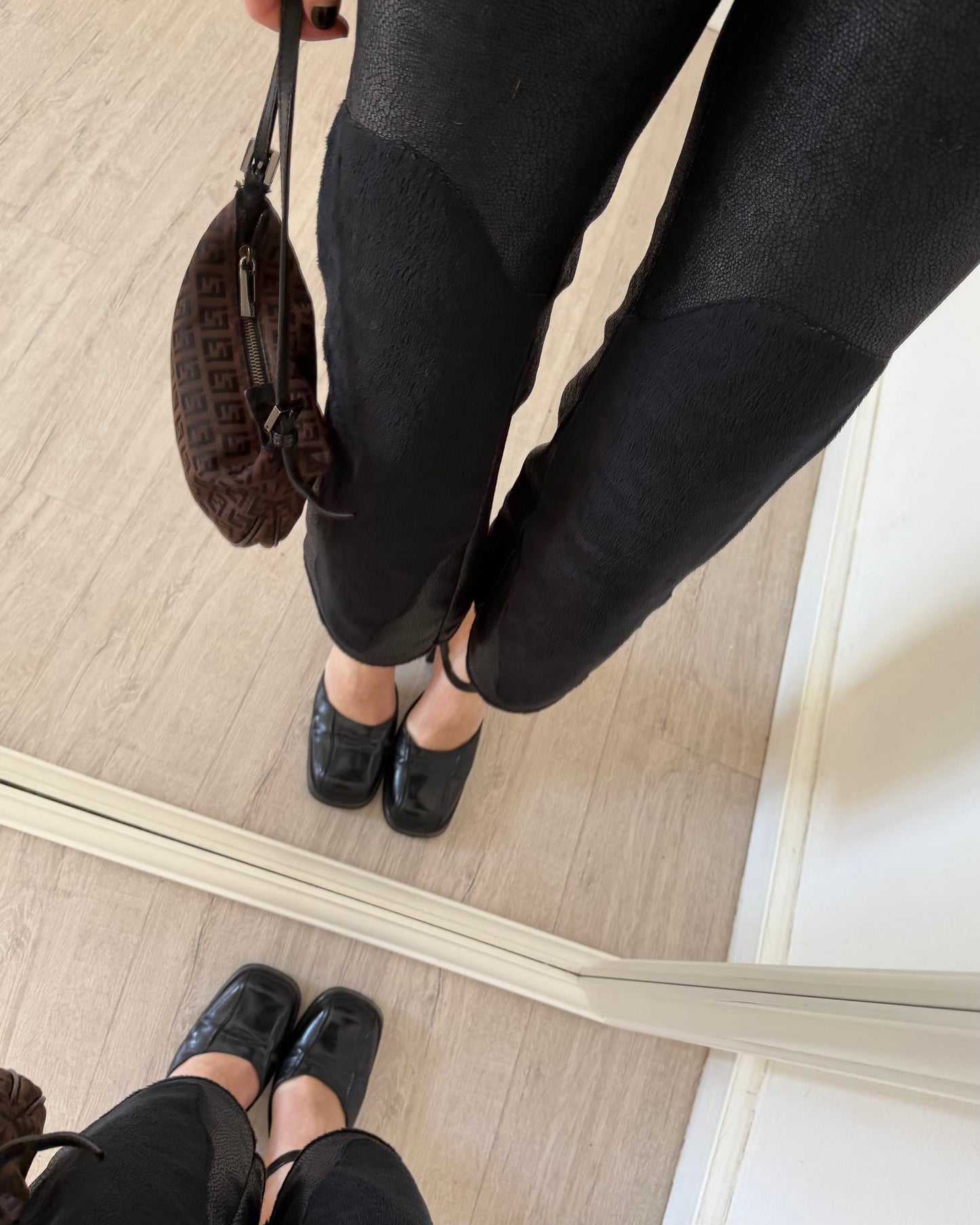 Black faux leather trousers