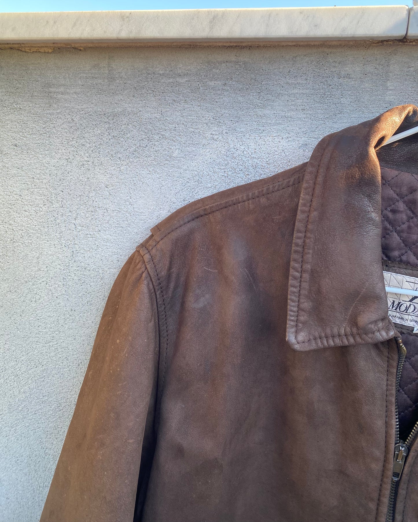 Brown leather bomber jacket