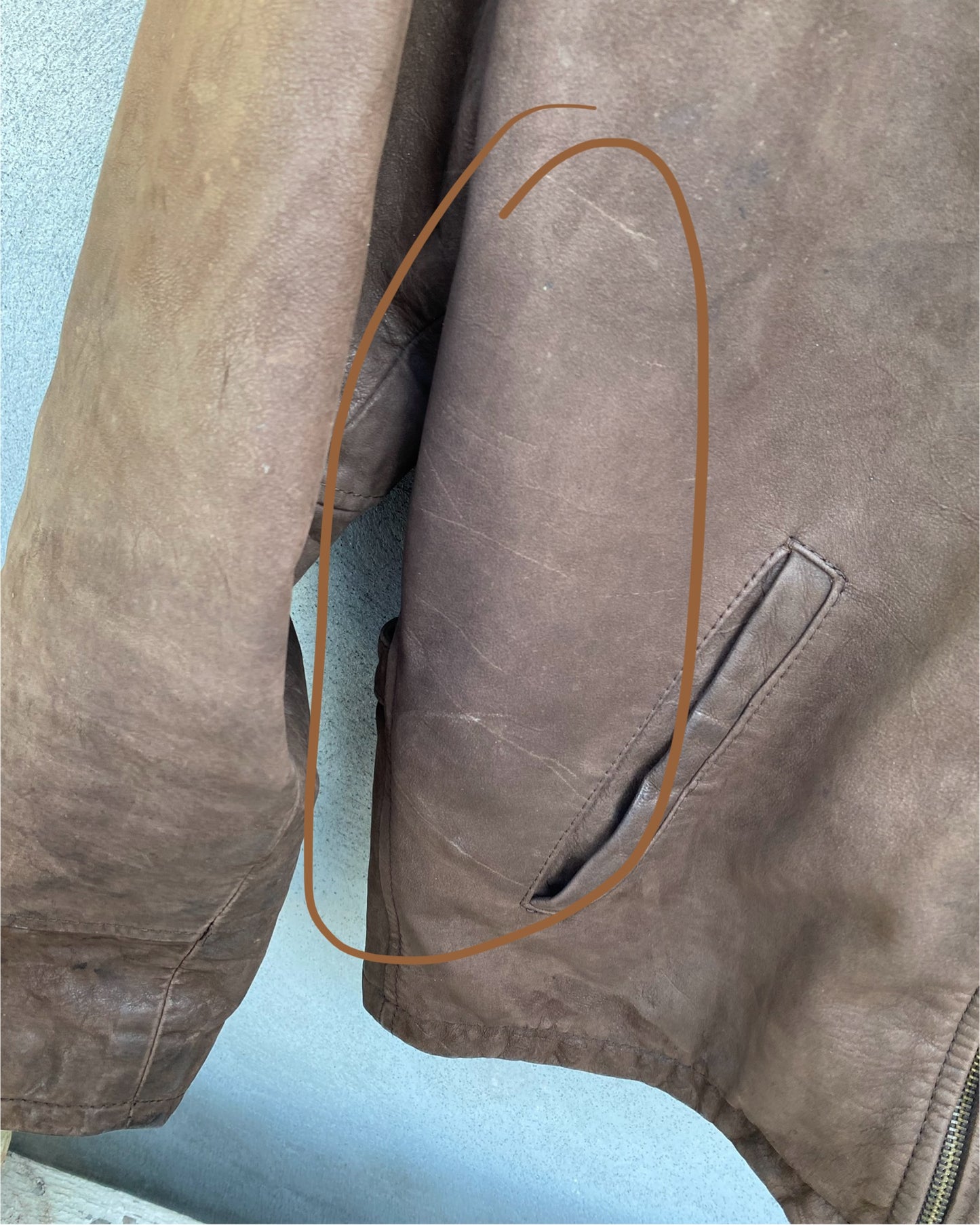 Brown leather bomber jacket