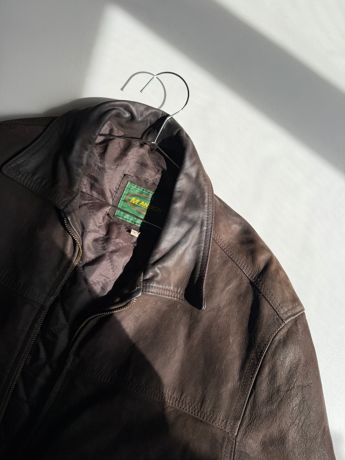 Brown distressed leather bomber jacket