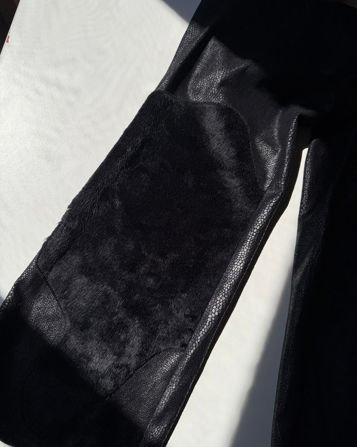 Black faux leather trousers