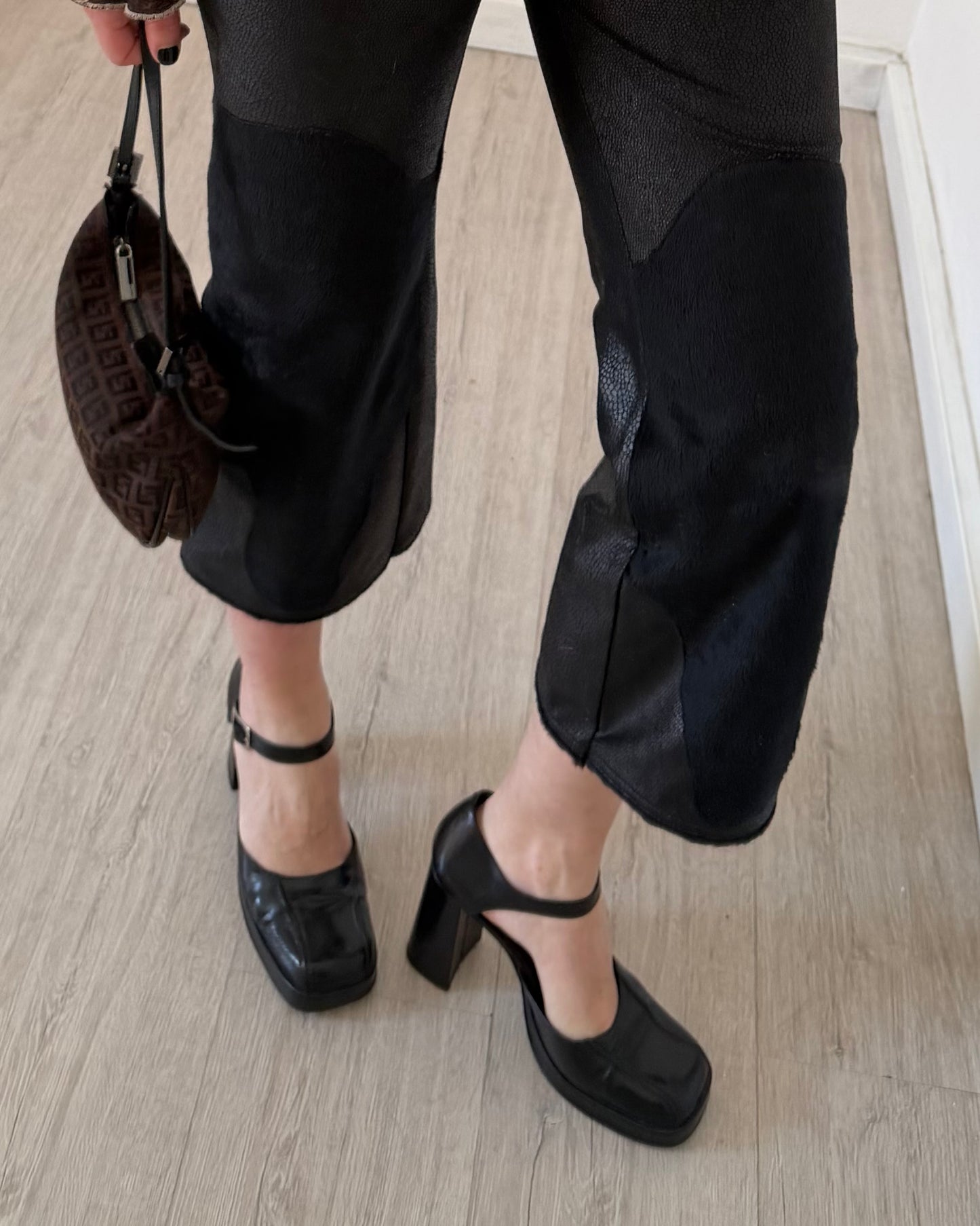Black faux leather trousers