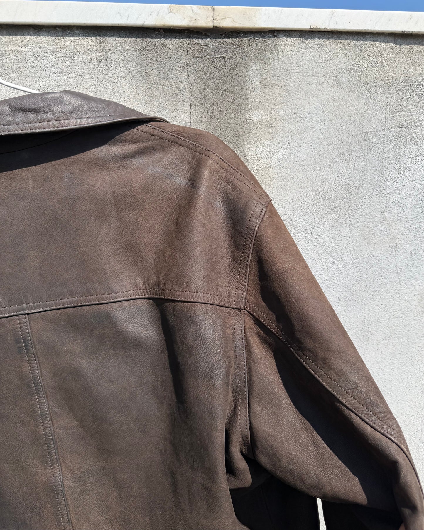 Brown distressed leather bomber jacket