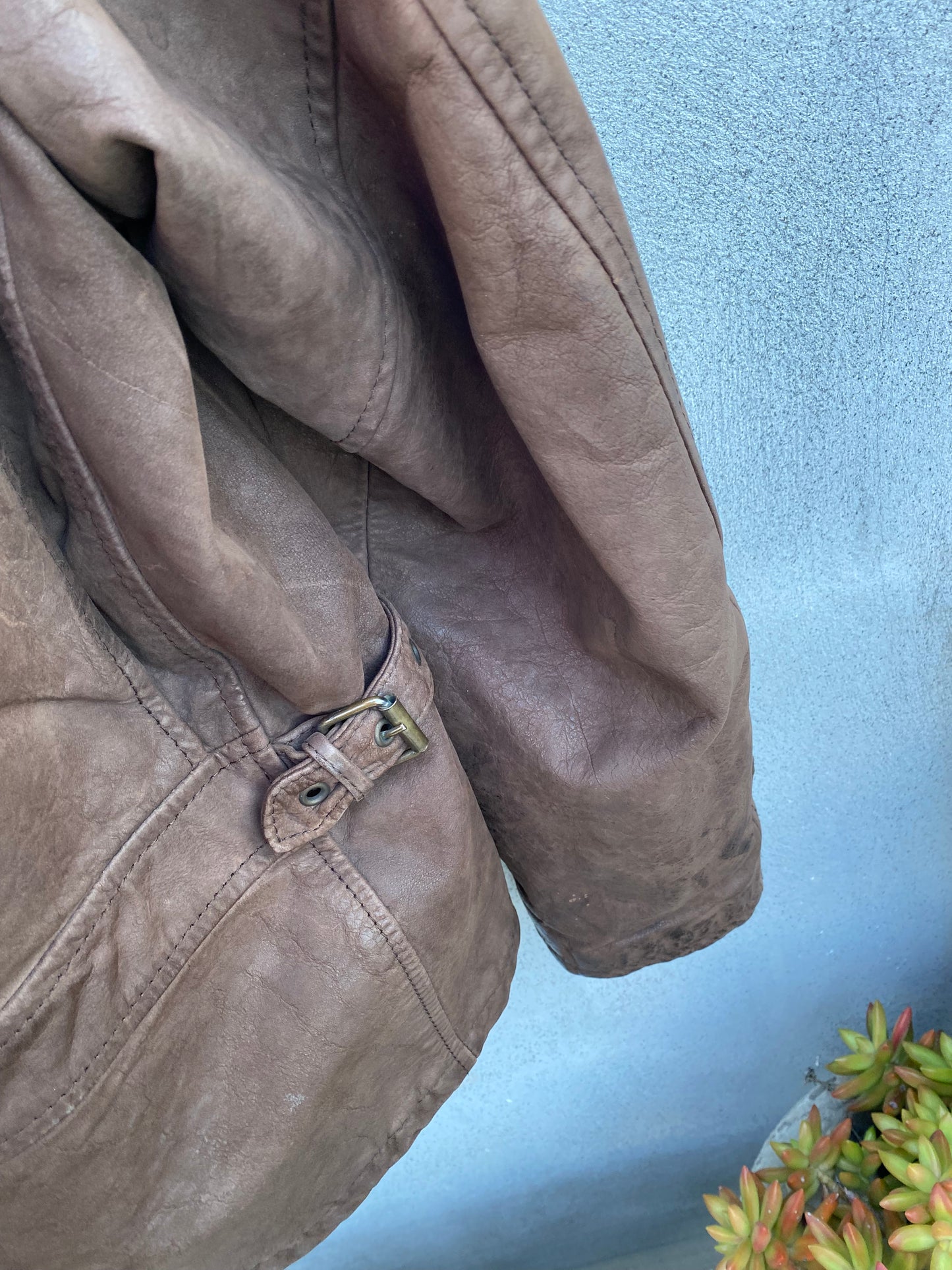 Brown leather bomber jacket