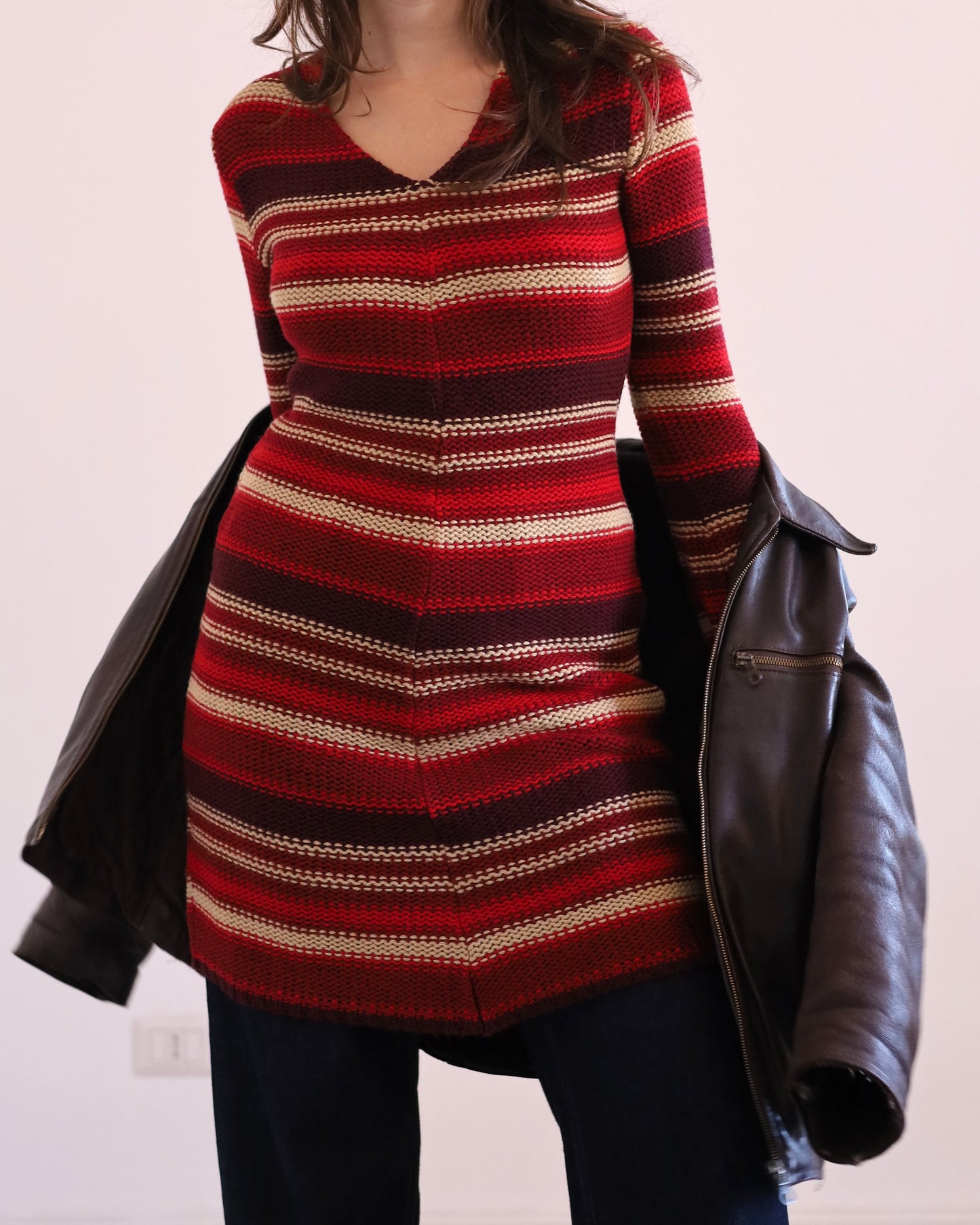 Knitted striped dress with asymmetric hem