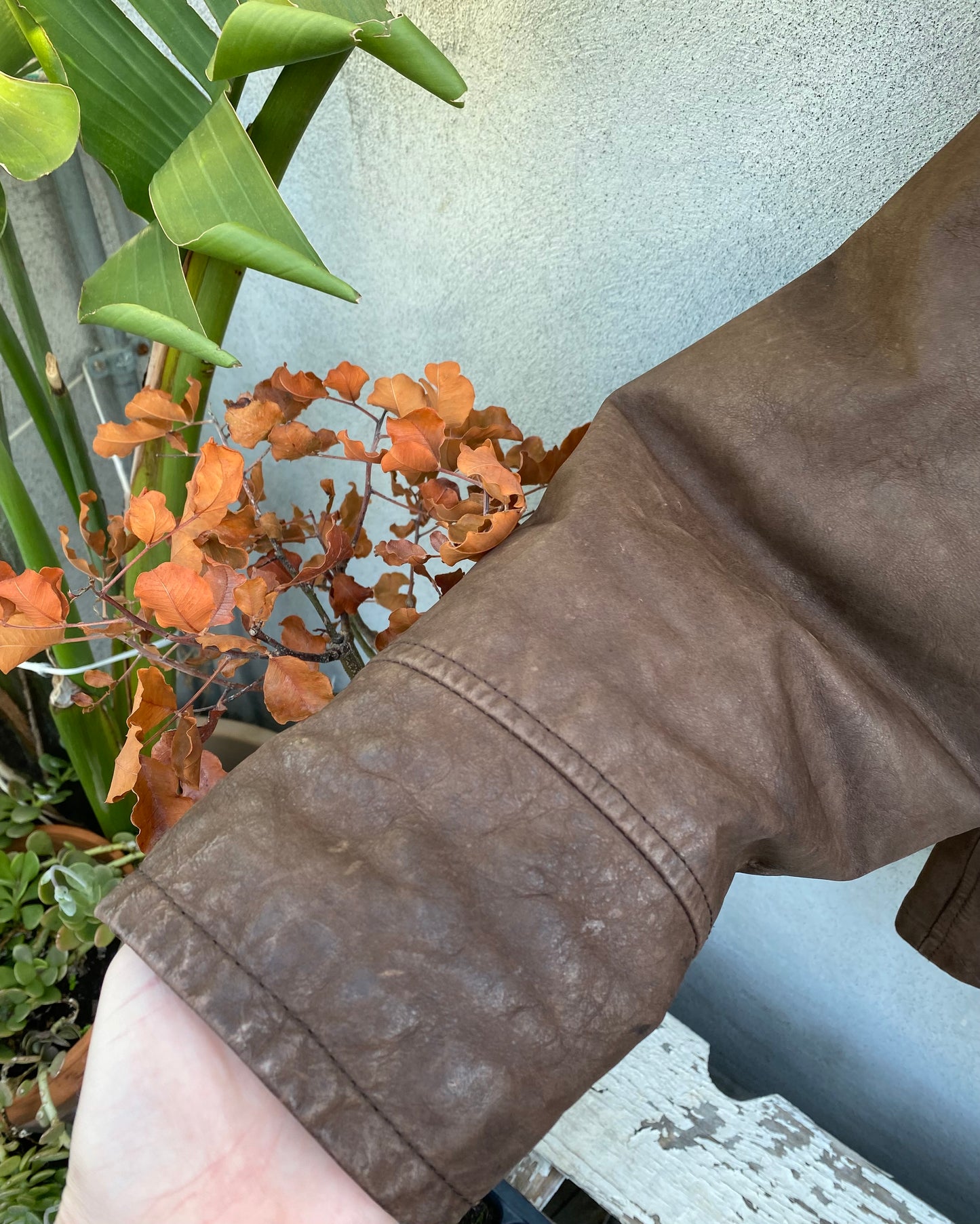 Brown leather bomber jacket