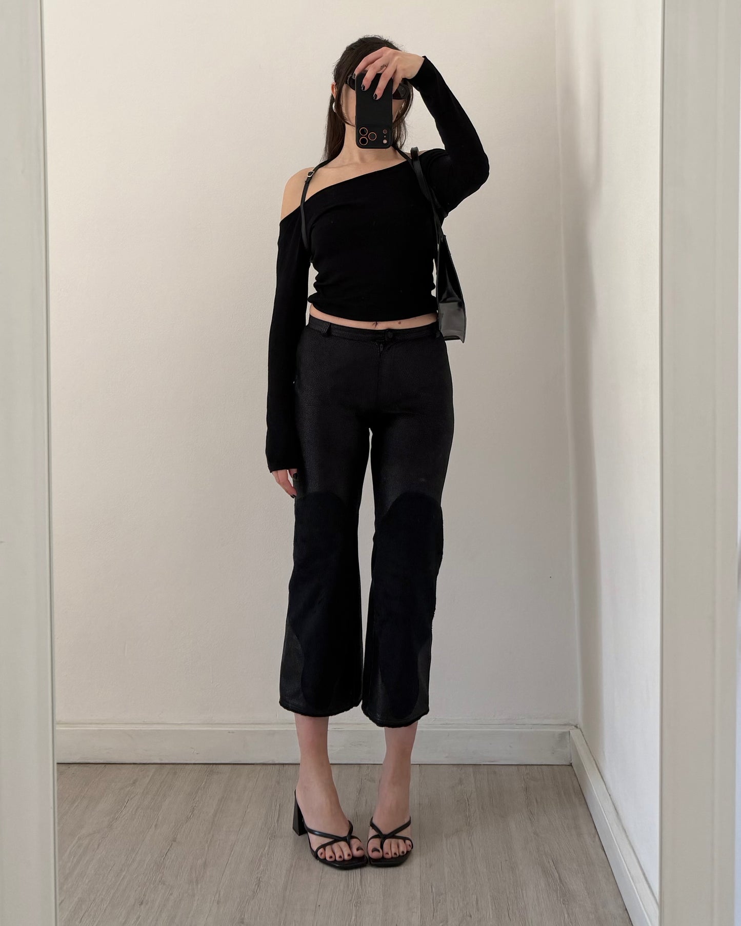 Black faux leather trousers