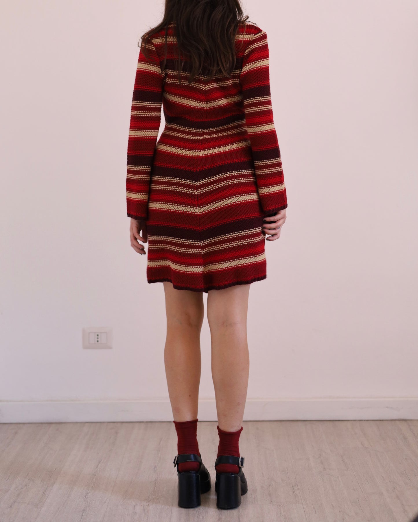 Knitted striped dress with asymmetric hem