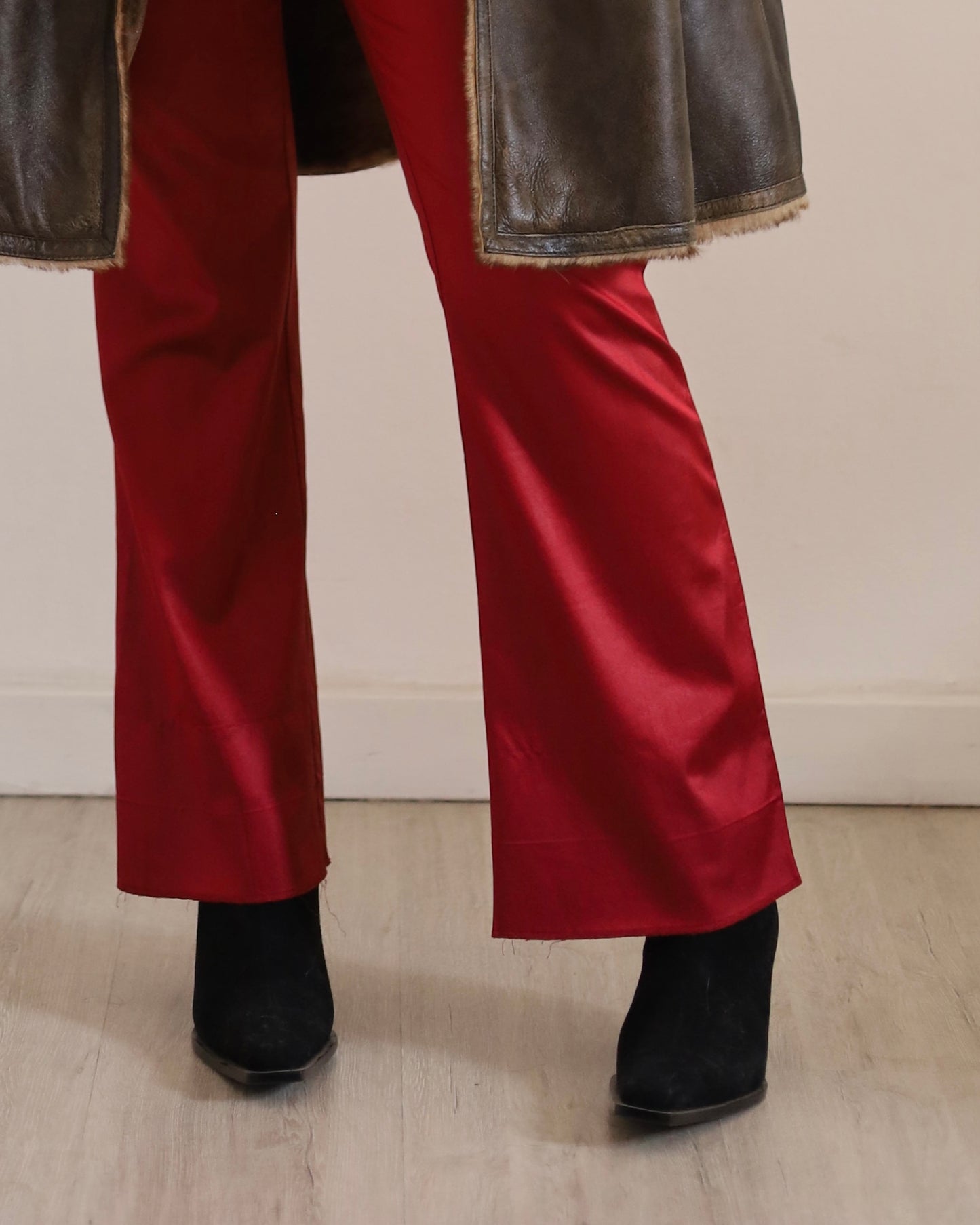 Red satin flare trousers