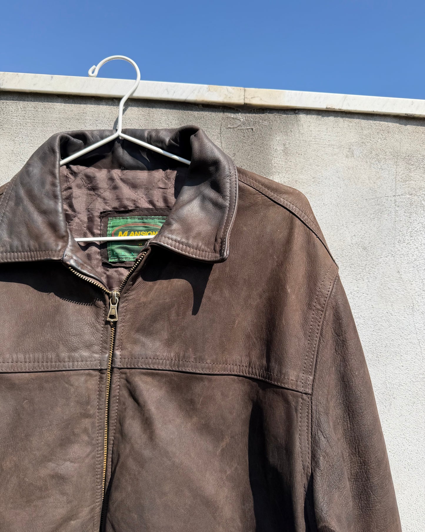 Brown distressed leather bomber jacket