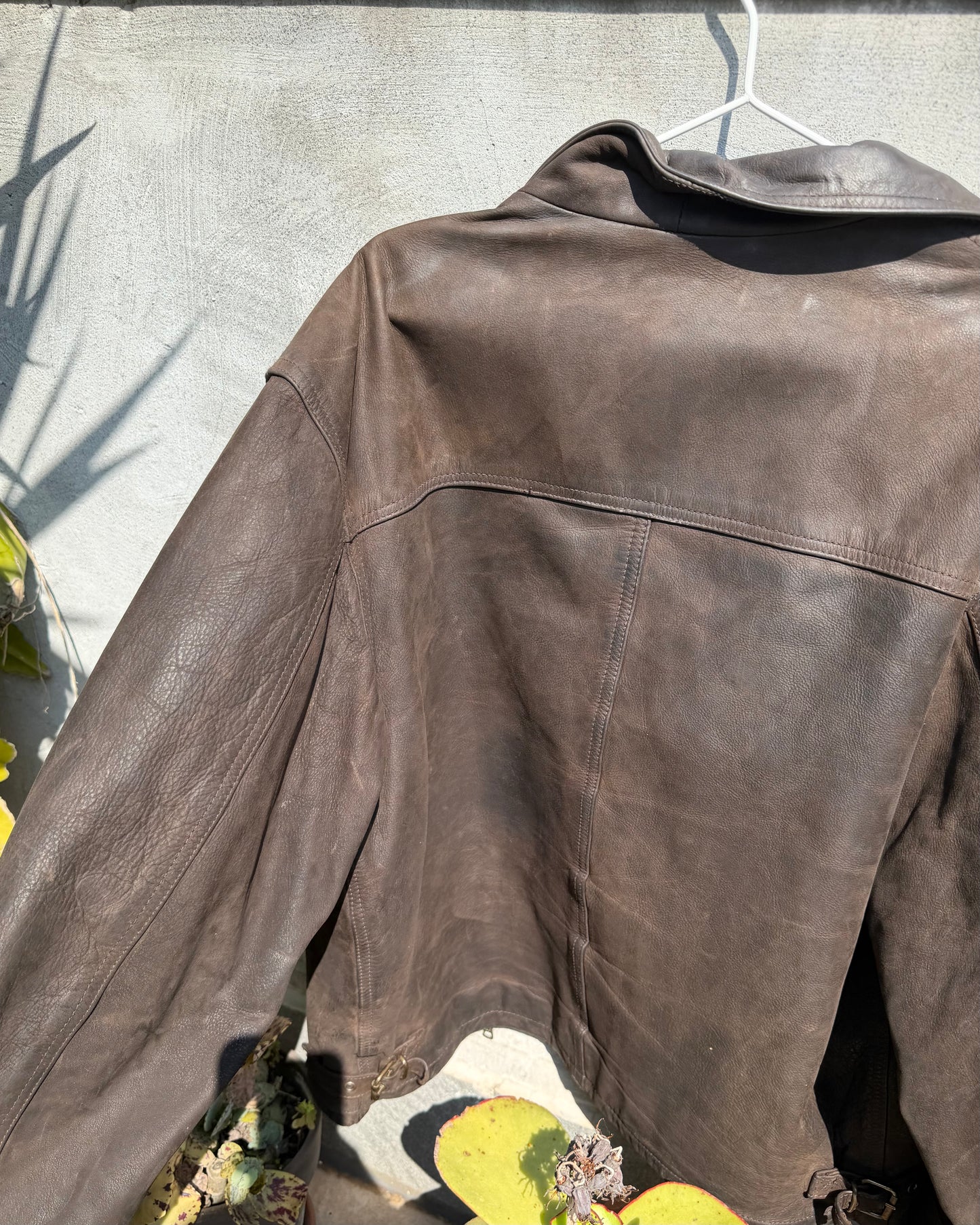 Brown distressed leather bomber jacket