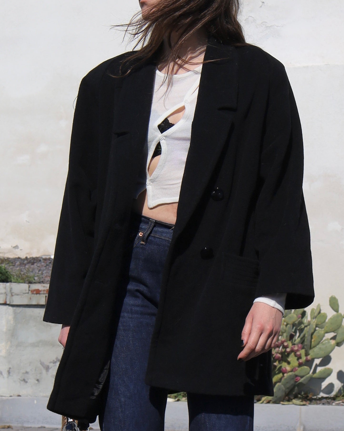 Manteau noir en laine à double boutonnage