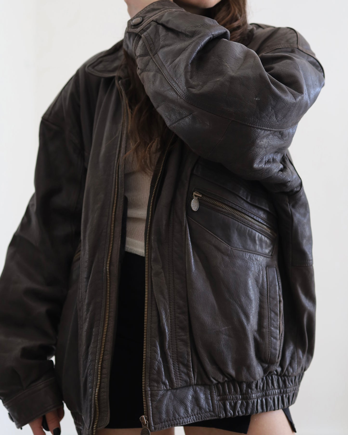 Brown leather bomber jacket