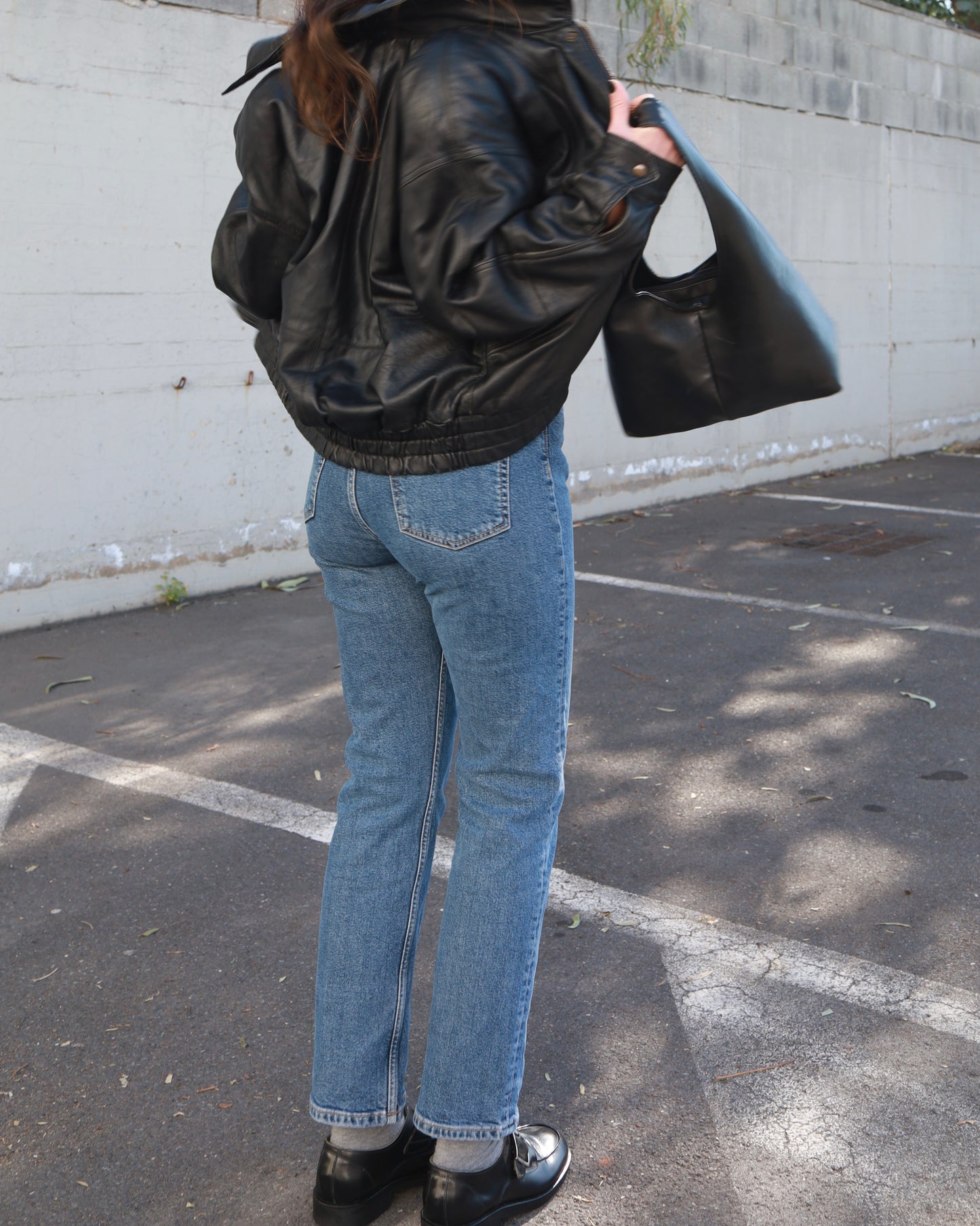 Black leather bomber jacket