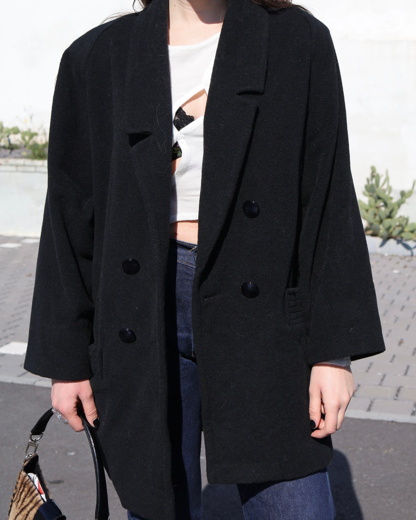 Manteau noir en laine à double boutonnage