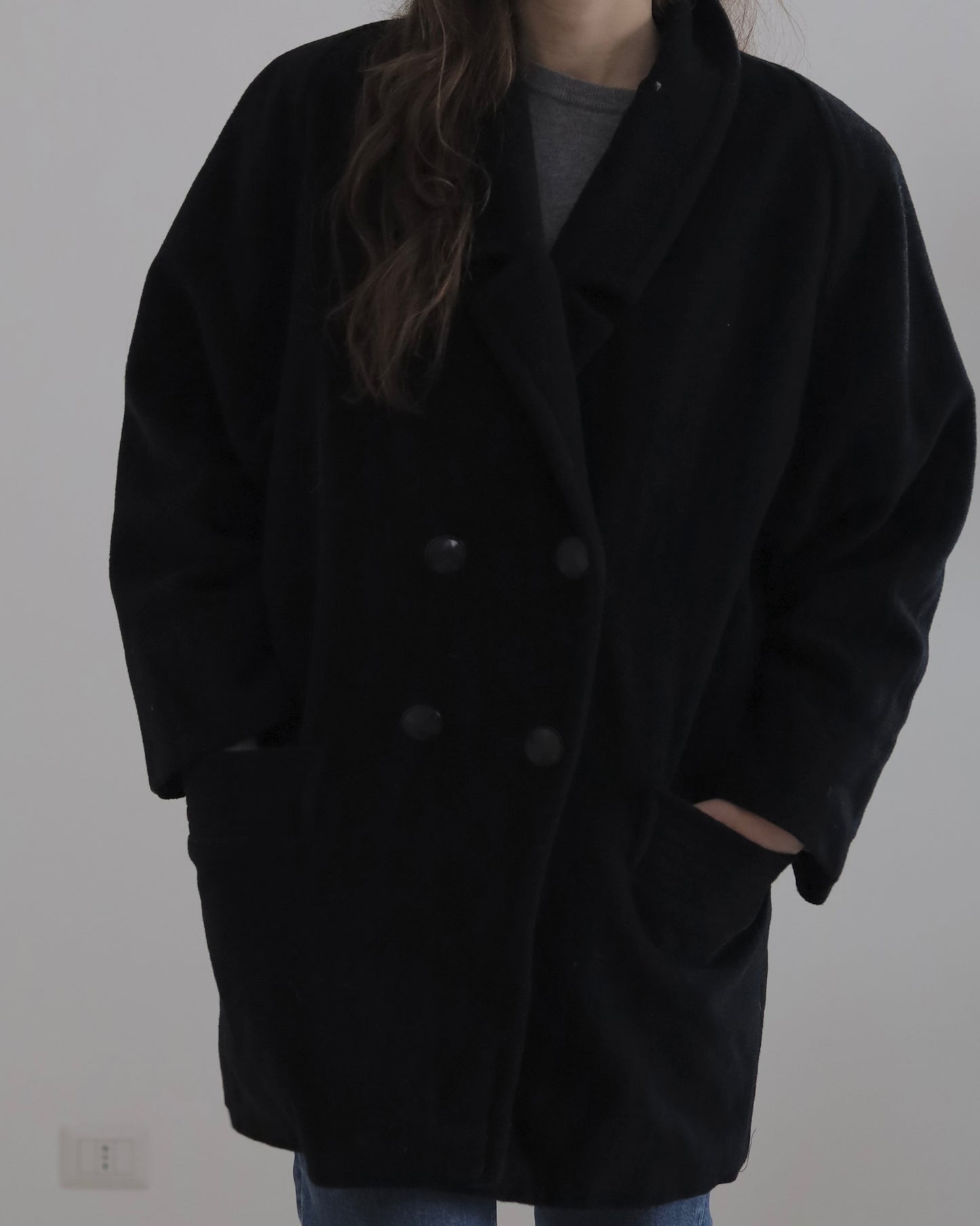 Manteau noir en laine à double boutonnage